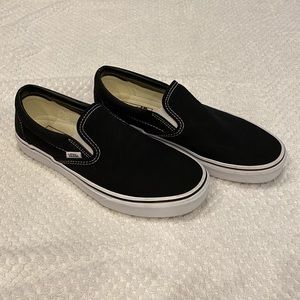 Vans black canvas slip-ons